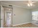 Bedroom featuring wood flooring and an entrance to a balcony and a window at 4904 38Th S Way # 316, St Petersburg, FL 33711