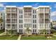 Lovely condominium building featuring private screened balconies and tropical landscaping at 4904 38Th S Way # 316, St Petersburg, FL 33711