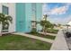 Attractive condo building entrance with lush landscaping and private boat access at 4904 38Th S Way # 316, St Petersburg, FL 33711
