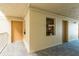 Hallway leading to unit featuring elegant flooring, neutral walls, and pretty floral decor at 4904 38Th S Way # 316, St Petersburg, FL 33711