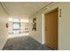Hallway to unit featuring carpeted floors and attractive decor at 4904 38Th S Way # 316, St Petersburg, FL 33711