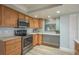 Kitchen featuring stainless steel appliances and wooden cabinets with light countertops at 4904 38Th S Way # 316, St Petersburg, FL 33711
