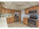 Bright kitchen featuring light countertops, stainless steel appliances, and wooden cabinets at 4904 38Th S Way # 316, St Petersburg, FL 33711