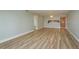Spacious open-concept living area with wood flooring extending into the kitchen at 4904 38Th S Way # 316, St Petersburg, FL 33711