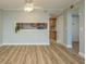 Open living space with luxury vinyl plank flooring and a view of the kitchen at 4904 38Th S Way # 316, St Petersburg, FL 33711