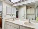 Bathroom with double sink vanity and ample cabinet space at 4955 Grist Mill Cir, New Port Richey, FL 34655