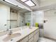 Bathroom features double sinks, vanity, and shower at 4955 Grist Mill Cir, New Port Richey, FL 34655