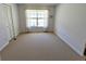 Bright bedroom with large window and spacious closet at 4955 Grist Mill Cir, New Port Richey, FL 34655