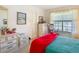 Comfortable bedroom with dresser and view from window at 4955 Grist Mill Cir, New Port Richey, FL 34655