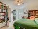 Comfortable bedroom featuring a large bed and sliding glass doors at 4955 Grist Mill Cir, New Port Richey, FL 34655