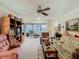 Comfortable living room with plush seating, wooden furniture, and a view of the outdoor patio at 4955 Grist Mill Cir, New Port Richey, FL 34655