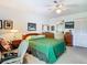 Serene main bedroom with a comfortable bed, two dressers, and an en-suite bathroom at 4955 Grist Mill Cir, New Port Richey, FL 34655