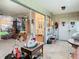 Sunroom with view of interiors and living area at 4955 Grist Mill Cir, New Port Richey, FL 34655