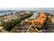 Aerial view of condo community, showing waterways, boat docks, parking lots, landscaping, and waterfront access at 5000 Culbreath Key Way # 1-310, Tampa, FL 33611