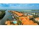 Stunning aerial showcasing waterfront condos, boat docks, canal access, community pool, and beautiful scenery at 5000 Culbreath Key Way # 1-310, Tampa, FL 33611