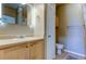 Well-lit bathroom featuring a vanity with a sink and a toilet, complemented with tile flooring at 5000 Culbreath Key Way # 1-310, Tampa, FL 33611