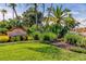 Well-maintained community entrance sign surrounded by lush landscaping, enhancing curb appeal at 5000 Culbreath Key Way # 1-310, Tampa, FL 33611