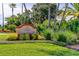 Beautifully landscaped entrance to Culbreath Key, showcasing lush greenery and colorful flowers at 5000 Culbreath Key Way # 1-310, Tampa, FL 33611