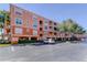 Multi-story condo building with covered parking, outdoor balconies, lush landscaping, and a well-maintained parking area at 5000 Culbreath Key Way # 1-310, Tampa, FL 33611