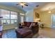 Comfortable living area with a plush sectional sofa, large window, and light-filled room at 5000 Culbreath Key Way # 1-310, Tampa, FL 33611