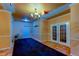 Welcoming lobby area with modern lighting, elegant tiled floors, and double-door entry to residences at 5000 Culbreath Key Way # 1-310, Tampa, FL 33611