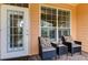 Cozy porch seating area next to the home's entryway at 5000 Culbreath Key Way # 1-310, Tampa, FL 33611