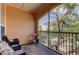 Outdoor seating area with a screened-in porch with tree views at 5000 Culbreath Key Way # 1-310, Tampa, FL 33611