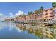 Waterfront condo complex with boat docks and stunning water views reflecting the coastal lifestyle at 5000 Culbreath Key Way # 1-310, Tampa, FL 33611