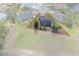 Aerial view of the property showcasing the backyard and surrounding neighborhood, marked by a red outline at 5140 Eclipse Ct, Spring Hill, FL 34607
