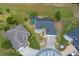 Aerial view of the property showcasing the home, backyard with pool, and surrounding landscaped areas at 5140 Eclipse Ct, Spring Hill, FL 34607