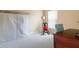Bedroom with closet, rocking chair, desk, and window at 5140 Eclipse Ct, Spring Hill, FL 34607