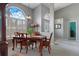 Elegant dining area featuring a dining table, soft colors, and an arch window at 5140 Eclipse Ct, Spring Hill, FL 34607