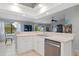 Kitchen counter overlooking the living room and dining area at 5140 Eclipse Ct, Spring Hill, FL 34607
