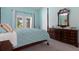 Serene main bedroom featuring soft blue walls and comfortable furnishings at 5140 Eclipse Ct, Spring Hill, FL 34607