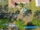 Aerial shot of a home's backyard featuring a fire pit area with seating and a playground at 5162 11Th E St, Bradenton, FL 34203