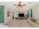 Spacious living room with ceiling fan, TV, and neutral color palette at 5162 11Th E St, Bradenton, FL 34203