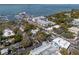 Stunning aerial view showcases the area with waterfront buildings, marinas, and coastal charm at 650 Jacaranda St, Dunedin, FL 34698