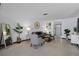 Neutral living room with a gray sofa, accent chair, and modern decor at 650 Jacaranda St, Dunedin, FL 34698