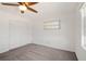 Bright bedroom with white walls, carpeted floors, ceiling fan and closet at 709 Flamingo Dr, Apollo Beach, FL 33572