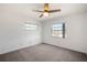 Bedroom with white walls, carpeted floors, and natural light at 709 Flamingo Dr, Apollo Beach, FL 33572