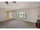 Living room with a large window allowing natural light to flow into the room and tile flooring at 709 Flamingo Dr, Apollo Beach, FL 33572