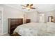 Spacious main bedroom featuring a ceiling fan, carpeted floors and ensuite bathroom at 709 Flamingo Dr, Apollo Beach, FL 33572