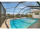 A gorgeous, screened-in pool overlooks the canal, perfect for relaxing and enjoying waterfront living at 709 Flamingo Dr, Apollo Beach, FL 33572