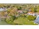 Aerial view of a waterfront property with mature trees surrounding the spacious backyard at 7201 Hodgewood Ct, Tampa, FL 33614