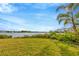 Lush backyard with lake views offering tranquil outdoor space at 7201 Hodgewood Ct, Tampa, FL 33614