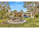 Stunning backyard with a beautiful fountain and outdoor pergola, perfect for relaxing or entertaining at 7201 Hodgewood Ct, Tampa, FL 33614