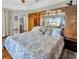 Bedroom featuring a large bed with blue and white bedding and built in wood cabinets at 7201 Hodgewood Ct, Tampa, FL 33614