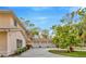 Three-car garage offers ample parking and storage space, complementing the home's exterior at 7201 Hodgewood Ct, Tampa, FL 33614