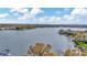 Breathtaking aerial of a serene lake surrounded by lush trees and residential homes at 7201 Hodgewood Ct, Tampa, FL 33614