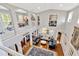 Bright open-plan living room with hardwood floors, plush sofas, and elegant chandelier at 7201 Hodgewood Ct, Tampa, FL 33614